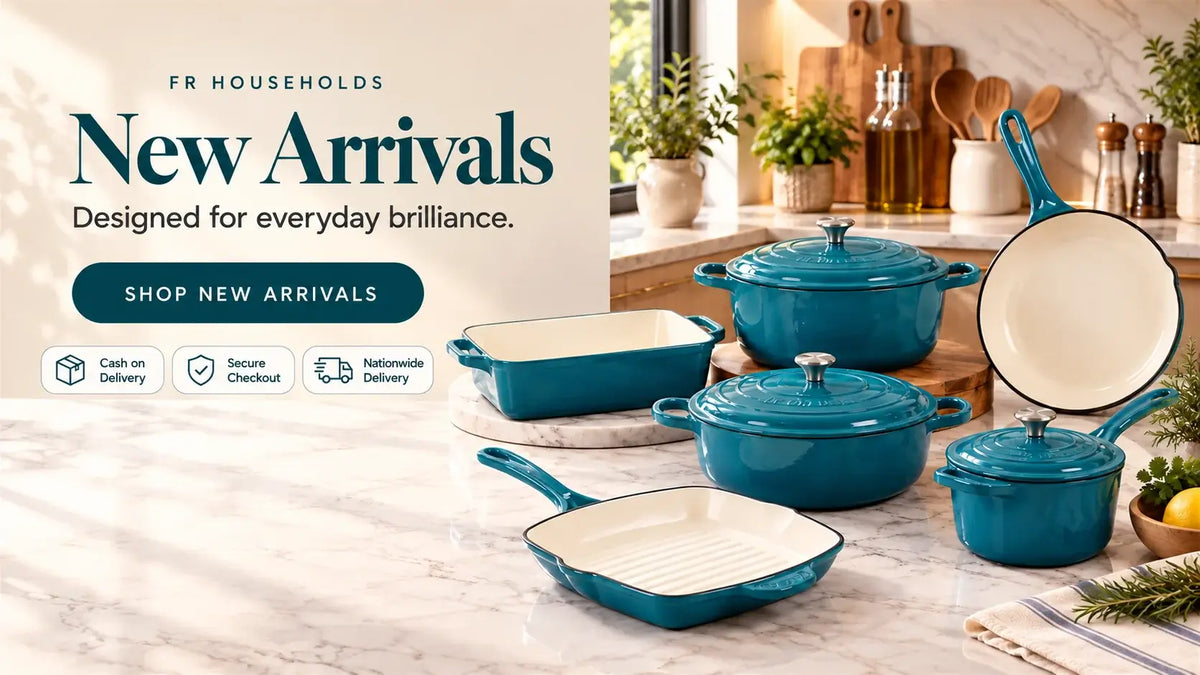 FR Households teal enameled cast iron cookware set including pots, pans, and baking dishes on a modern marble kitchen countertop.